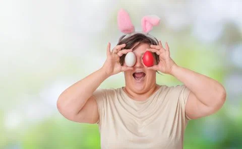 Plus size woman with easter eggs Stock Photos