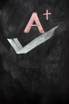 A plus written on a blackboard Stock Photos
