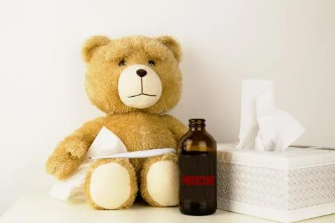 Plush bear is sick, has  rhinitis and temperature. Stock Photos