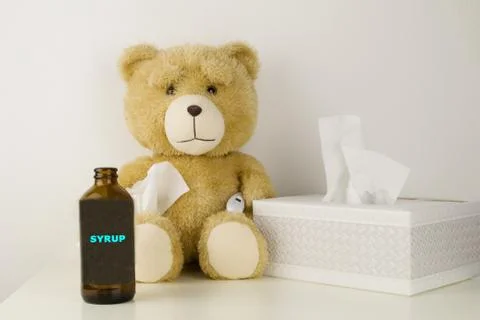 Plush bear is sick, has  rhinitis and temperature. Stock Photos