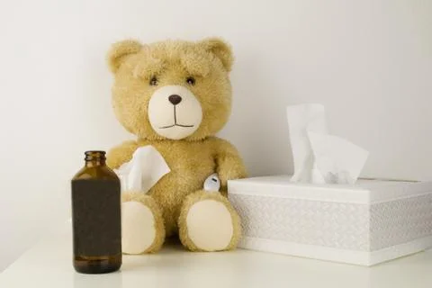 Plush bear is sick, has  rhinitis and temperature. Stock Photos