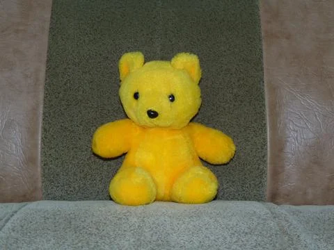 Plush bear on a sofa Fotos Stock