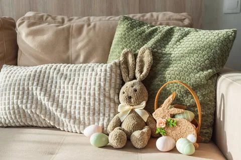Plush Bunny with Easter Basket and Eggs. Cozy Easter Decoration Stock Photos