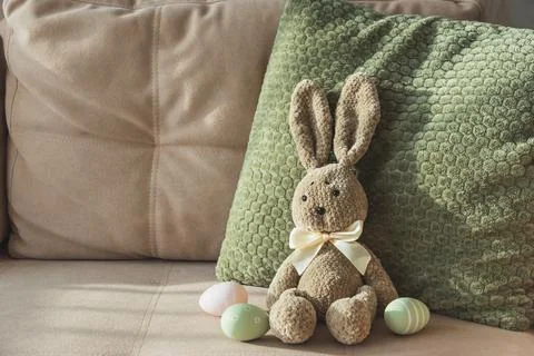 Plush Bunny with Easter Eggs. Cozy Easter Decoration 스톡 사진