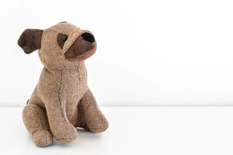 A plush puppet in the shape of a dog, a soft and tender toy for children Foto stock