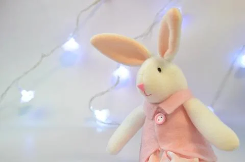 Plush rabbit on the background of lanterns. New year 2023. Stock Photos