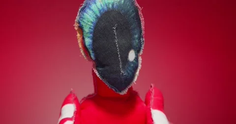 Plush Toy Poses in front of the Camera Lens on a Colorful Background. Stock Footage 148243478