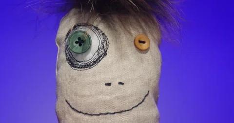 Plush Toy Poses in front of the Camera Lens on a Colorful Background. Stock Footage 148243483