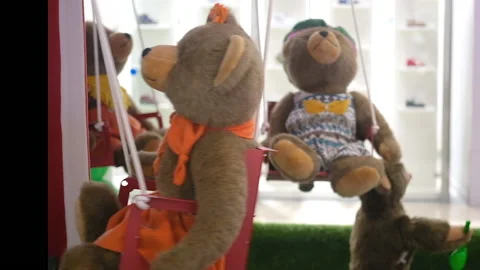 Plush toys bears on a carousel moving compositions, animated funny mechanical Stock Footage 161223687