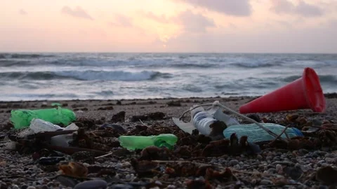 Plustic garbage on the ocean shore Stock Footage 220930239