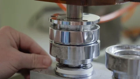 Pneumatic badge maker machine. Man creating personalized magnets. Stock Footage 101258530