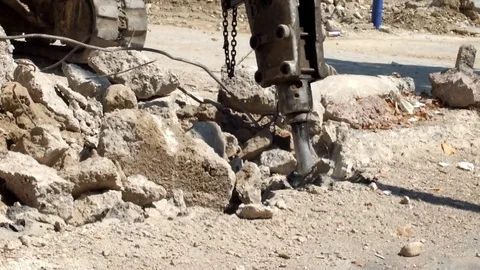 Pneumatic jackhammer drilling and breaking the concrete Stock Footage 76158635