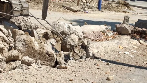 Pneumatic jackhammer drilling and breaking the concrete Stock Footage 76158708