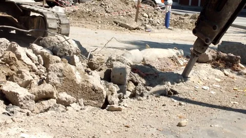 Pneumatic jackhammer drilling and breaking the concrete Stock Footage 76158725
