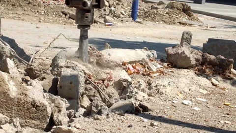 Pneumatic jackhammer drilling and breaking the concrete Stock Footage 76158823
