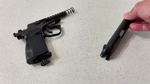 Pneumatic Pistol Breakdown with Slide, Barrel, and Spring Stock Footage 321999118