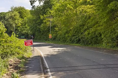 Pneumatic traffic counting tubes installed across rural road Stock Photos