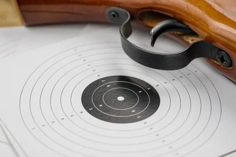 Pneumatic weapons on the shooting range. Shooting accessories on a wooden tab Stock Photos