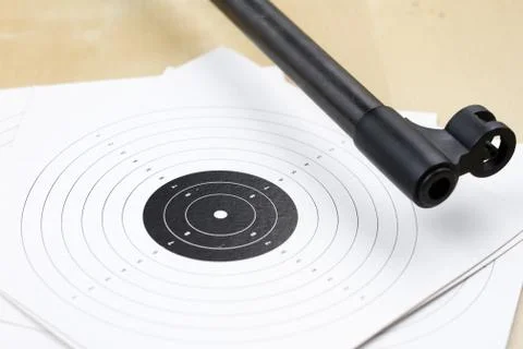 Pneumatic weapons on the shooting range. Shooting accessories on a wooden tab Stock Photos