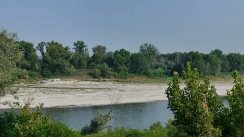 Po River with exposed sandbars during the 2026 heatwave in northern Italy Stock Footage 340763602