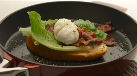 Poached egg with bacon on bread, Stock Footage 62810434