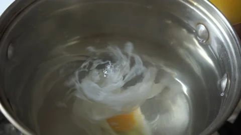 Poached egg boling Stock Footage 131857010