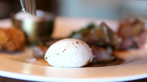 Poached egg Close up view medium rare steak served with bbq vegetables and sauce 스톡 동영상 301311345