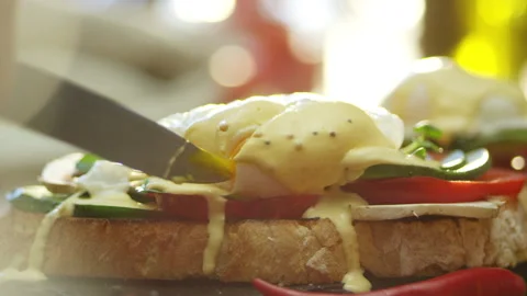 Poached egg on rye bread toast with avocado and green leaf salad Stock Footage 132974968