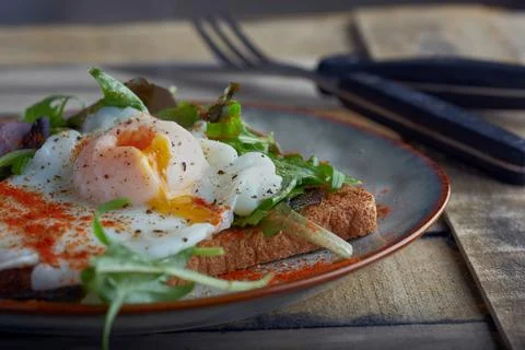 Poached egg on toast. Stock Photos