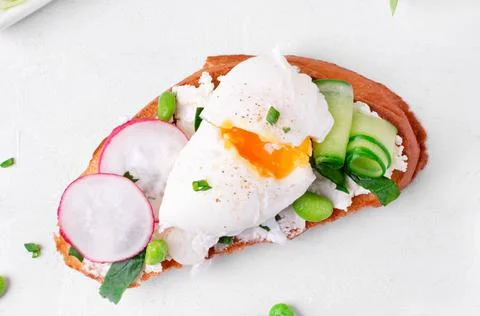 Poached egg on toasted bread Stock Photos