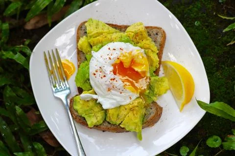 Poached Eggs and Avocado Stock Photos