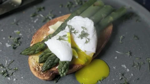 Poached Eggs With Asparagus Stock Footage 244712559