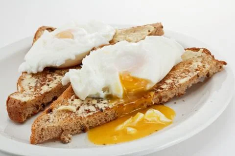 Poached eggs Stock Photos