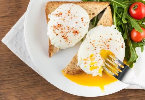 The poached eggs Stock Photos