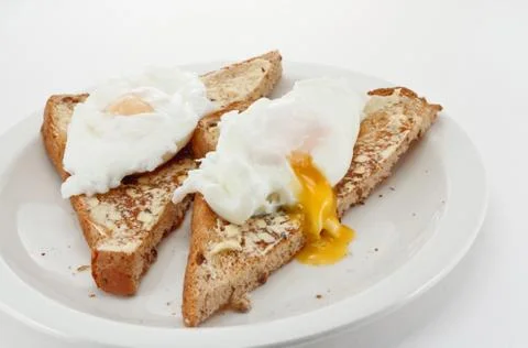 Poached eggs on toast Stock Photos