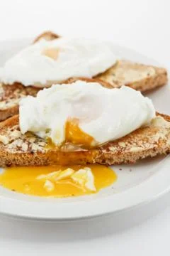 Poached eggs on toast Stock Photos