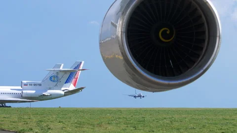 Pobeda Boeing 737 landing approach framed by jet engine at Kazan Airport Stock Footage 340108940