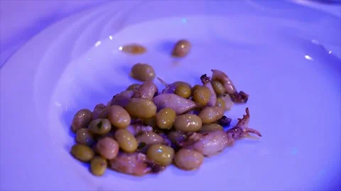 Pochas con chipirones (pochas beans and  small squid) , Spanish tapas Stock Footage 248527466