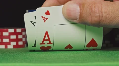 Pocket aces in a deck of playing cards with poker chips Stock Footage 142436761