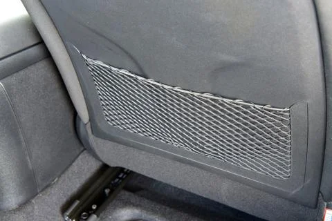 Pocket on the back of the car seat Stock Photos