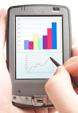 Pocket computer in a hand. Stock Photos