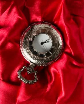 Pocket gray clock on red Stock Photos