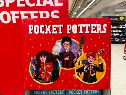 Pocket Potters display featuring wizard characters with broom owl and magic.. Stock Photos
