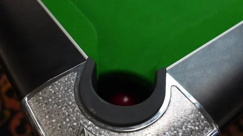 Pocket a red ball in blackball Pool game on a green cloth pool table Stock Footage 302510895
