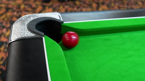 Pocket a red ball in blackball Pool game on a green cloth pool table Stock Footage 302511267