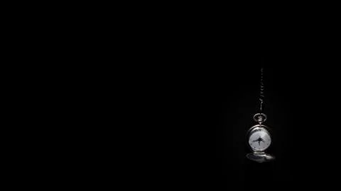 Pocket watch black background Photos