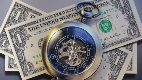 Pocket watch with dollar banknotes Video stock 223319227