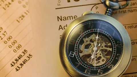 Pocket watch on financial papers as background Stockbeeldmateriaal 223318308