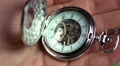 Pocket watch in male hand, minutes of human life, history. Time passing by HD Footage