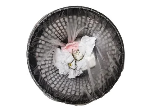 Pocket watch in refuse bin. Stock Photos